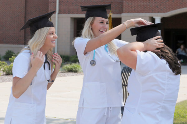 three nurses graduation