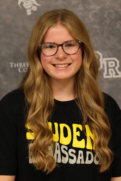 blonde woman smiling at camera