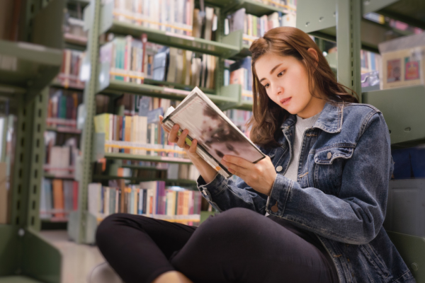 girl reading in library