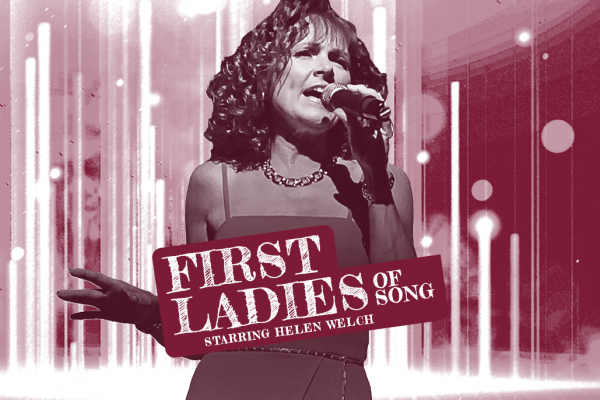 a woman singing on stage