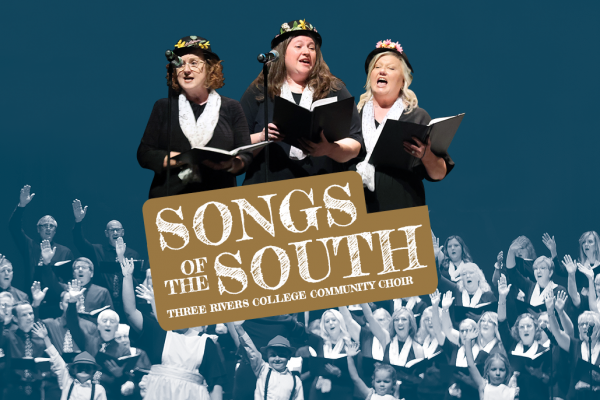 three women singing as part of a choir