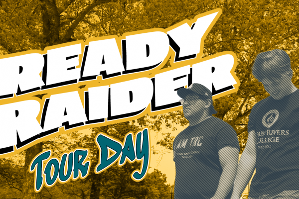 Ready Raider Tour day. two male students walking on campus